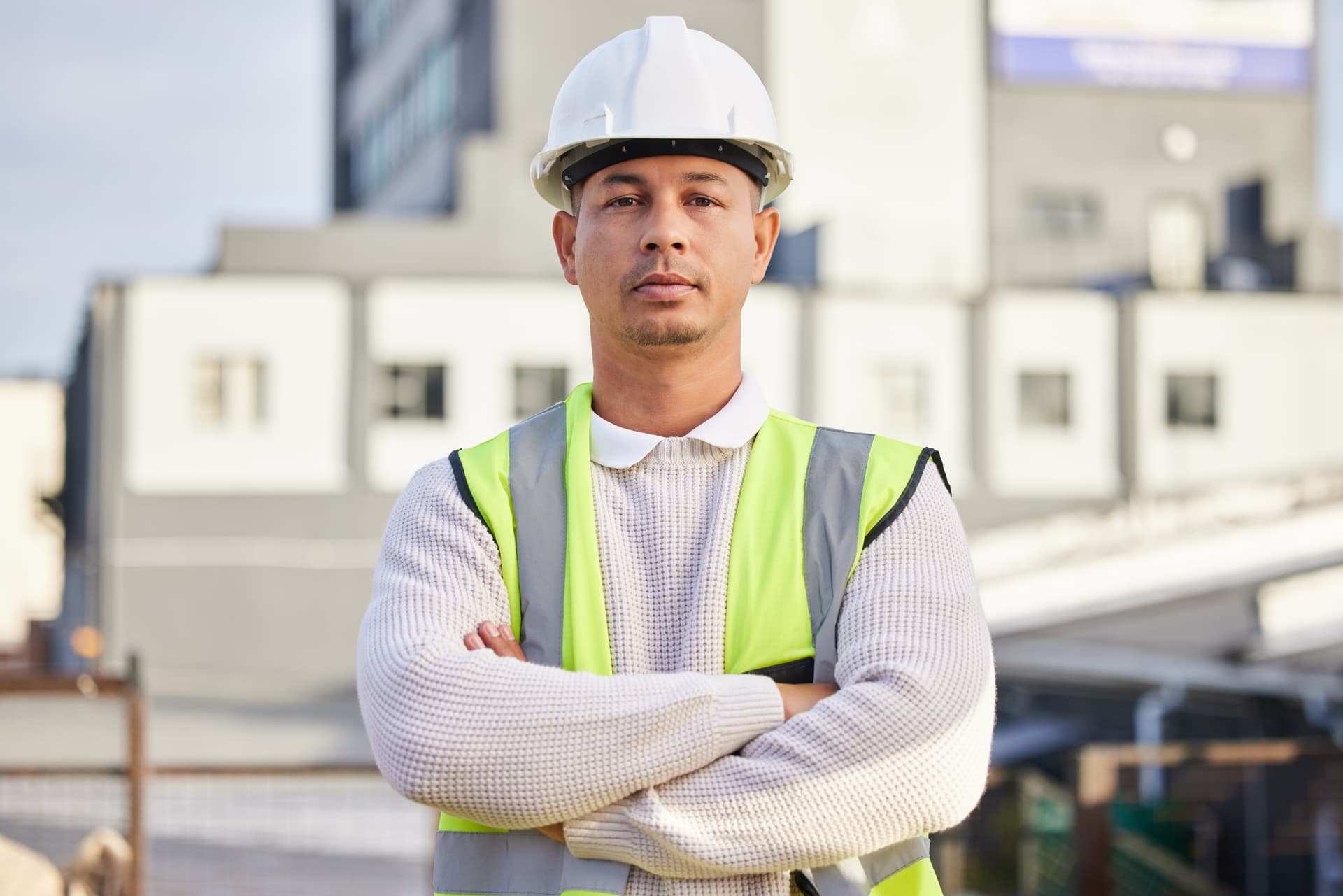 Engineer and construction professional standing confidently